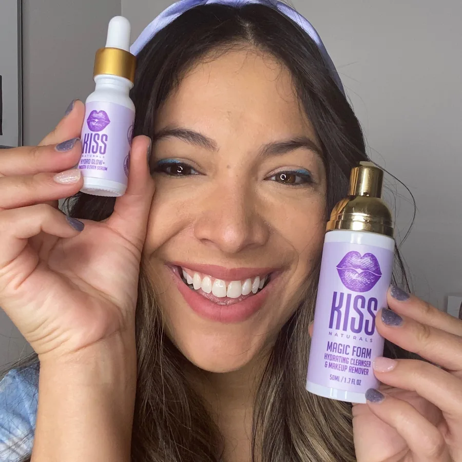 Zuleika holding Hydro Glow+ serum and Magic Foam
